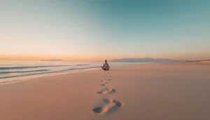 Experience tranquility at http://datanisle.com with a traveler meditating on a serene beach.